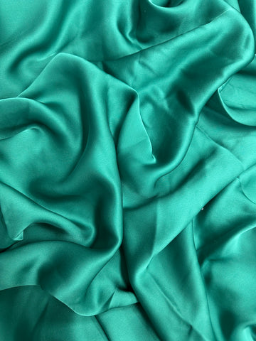 REF-103 BRIGHT GREEN SILK CHARMEUSE. ITALY. A CUT OF 2.5 YARDS